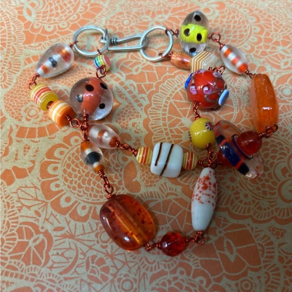 Glass Bead Bracelet with funky orange wire